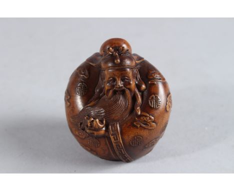 A CARVED WOOD CHINESE MAN NETSUKE. 2.25ins.