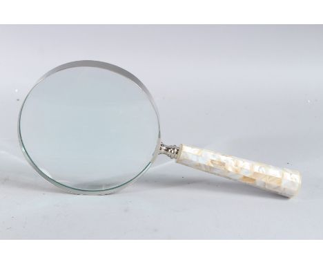 A LARGE MOTHER-OF-PEARL HANDLED MAGNIFYING GLASS.