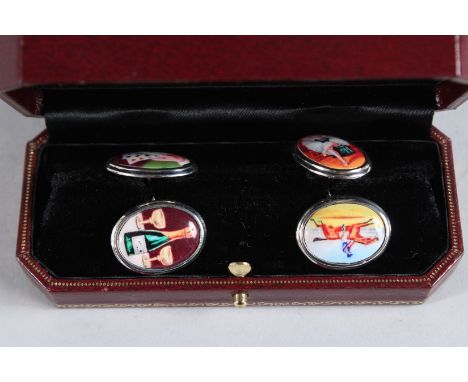 A SILVER AND ENAMEL FOUR VICES CUFFLINKS.