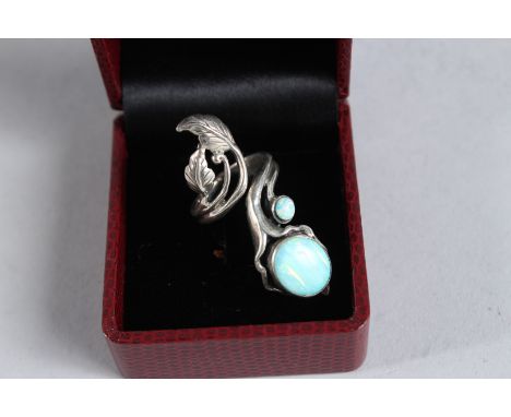 A SILVER AND OPAL ART NOUVEAU STYLE RING.