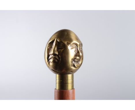 A THREE HEAD HANDLE WALKING STICK. 36ins long.
