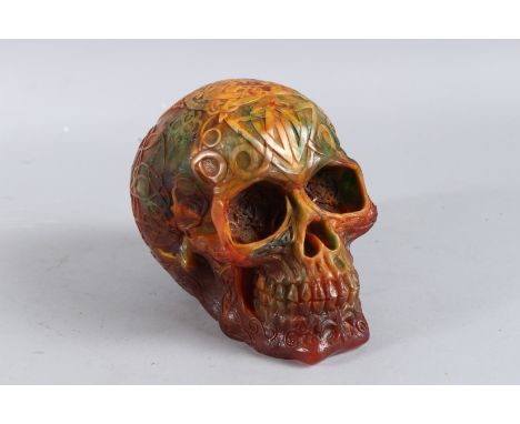 A CARVED AMBER SKULL. 6ins high.