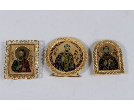 THREE 18CT GOLD MINIATURE ICONS with saints in enamel. Weight 60grms.