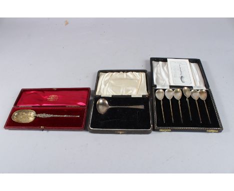 A CHILD'S CAST SILVER PUSHER AND SPOON, Birmingham 1943, a silver gilt cased anointing spoon and six cased coffee spoons.