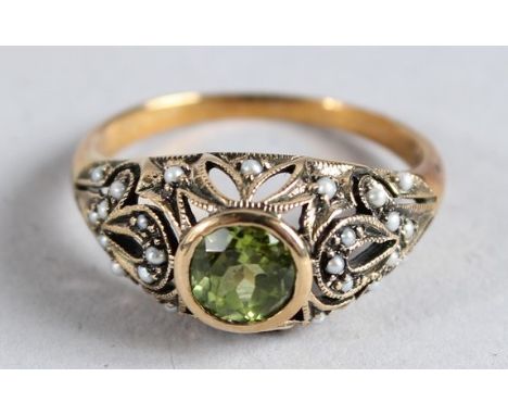 A 9CT GOLD PERIDOT AND PEARL RING.