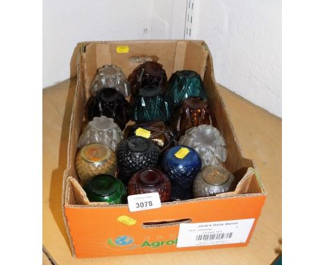 A group of coloured glass tea light holders, one box. (a quantity) 