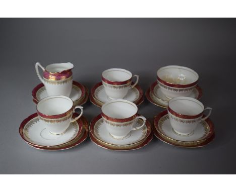 A Collection of Gilt and Pink Duchess Pattern Teacups, Saucers, Side Plates, Milk and Sugar 
