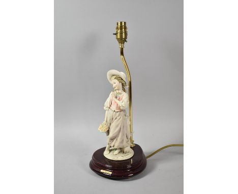 A Modern Figural Table Lamp in the Form of Girl with Bonnet and Posy of Flowers 