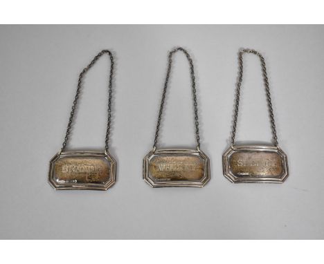 A Set of Three Silver Decanter Labels for Whisky, Brandy and Sherry 