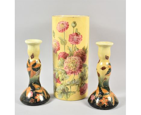 A Pair of Ceramic Candle Sticks and Cylindrical Floral Decorated Vase, 30.5cm high 