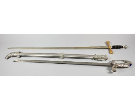 A Wilkinson Sword with Etched Blade and Wired Ribbed Handle Together with a Reproduction Indian Sword with Elephant Head Hand