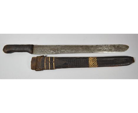 An African Leather Handled Machete in Leather Scabbard 