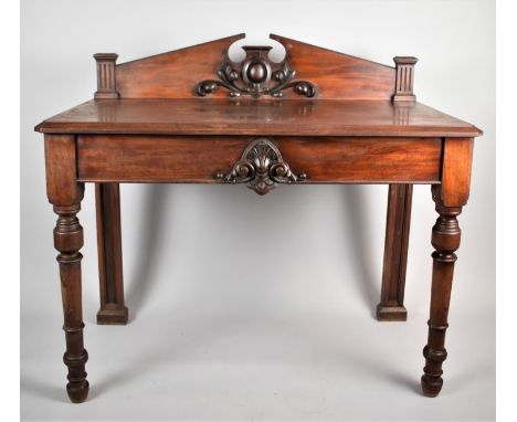 A Mid Victorian Mahogany Buffet or Serving Table with Raised Gallery and Swan Neck Cornice on Turned Support, 122cm wide 