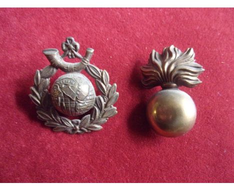 Royal Marine Light Infantry Cap Badge (Gilding-metal) and Royal Marine Artillery Cap Badge. K&amp;K: 1097 and 1108.