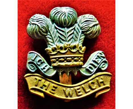 The Welsh Regiment Cap Badge (Bi-metal), slider, in 1930 the wording the scroll turned to 'Welch'. K&amp;K: 654
