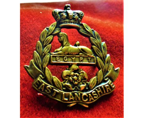 East Lancashire Regiment Victorian Other Ranks Forage Cap Badge (Gilding-metal), two lugs. K&amp;K: 637