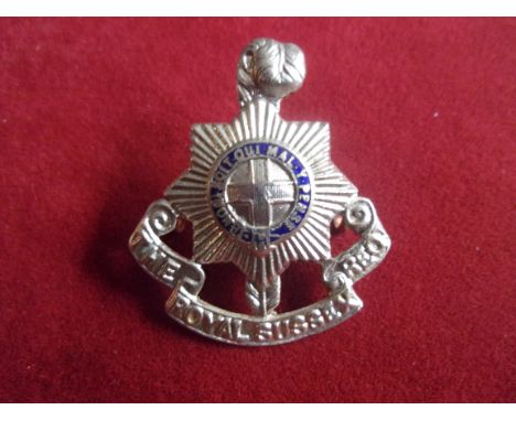 Royal Sussex Regiment WWI Officers Cap Badge (White-metal and enamel), two lugs, blue enamel in the circlet. K&amp;K: 646