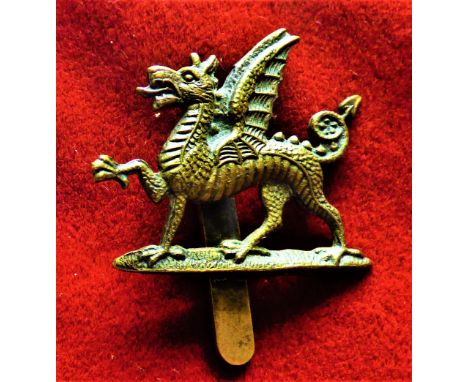 Monmouthshire Regiment 1st Battalion Territorial Forage Cap Badge (Brass), slider, worn 1908-1922. K&amp;K: 1769