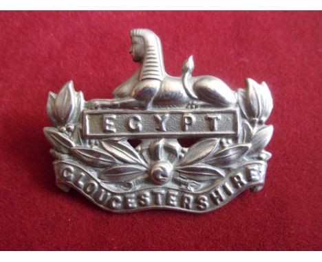 Gloucestershire Regiment  WWI Other Ranks Forage Cap Badge (White-metal), two lugs. K&amp;K: 634