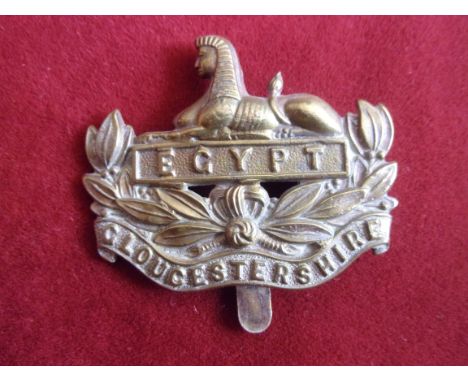 Gloucestershire Regiment  WWI War Economy Forage Cap Badge (Brass), slider. K&amp;K: 634