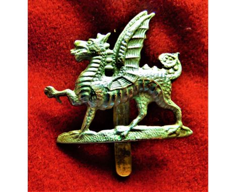 Monmouthshire Regiment 1st Battalion Territorial Other Ranks Forage Cap Badge (White-metal), slider, worn 1908-1922. K&amp;K:
