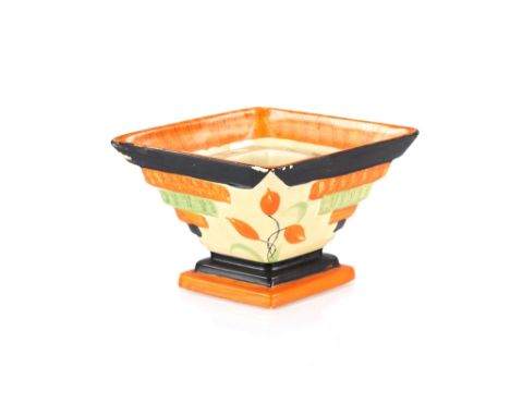 An Art Deco Myott & Sons vase of lozenge shape, complete with removable flower holder, brightly painted with flowers, 28cm lo