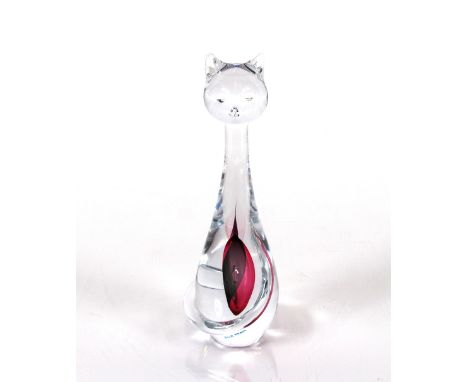 An Artcristal Bohemia Blue Praha glass model of a seated stylised cat with encased ruby coloured drop, 21cm high