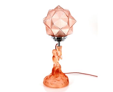 An Art Deco Walther and Sohne peach glass table lamp and shade, the column in the form of a seated nude female on rockwork ba