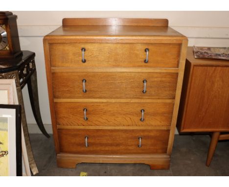 An Art Deco light oak chest fitted four long drawers, 78cm wide x 45cm deep x 95cm high