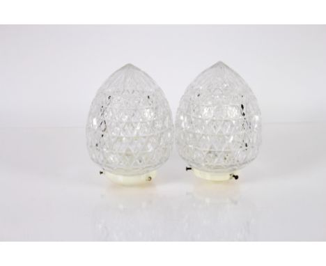 A pair of cut glass flambé shaped lamp shades