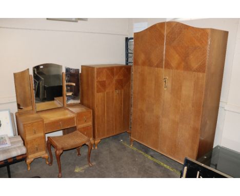 A 1930's Art Deco design bedroom suite, with oak parquetry decoration and Bakelite handles, comprising dressing table with tr