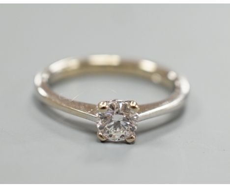 A modern Italian 750 white metal and solitaire diamond ring, size L/M, gross weight 2.8 grams.