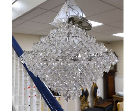 A ten tier, eighteen light, graduated chrome chandelier, with diamond shaped clear perspex drops