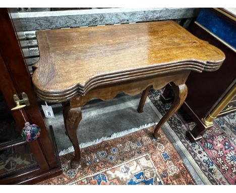 An 18th century style oak folding card table, width 82cm, depth 40cm, height 76cm