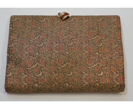 A vintage Christian Dior brocade clutch bag, with faux ruby set clasp and original mirror
