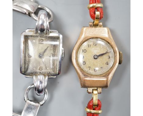 A lady's 9ct gold Rotary manual wind wrist watch, on a fabric strap, together with a lady's stainless steel manual wind wrist