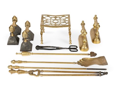A collection of fire tools and accessories19th century and laterIncluding a matched set of brass fire tools, a trivet, and tw
