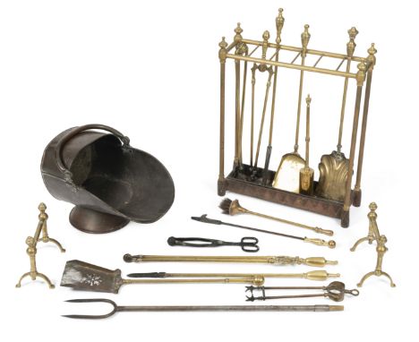 A collection of brass fire tools19th century and laterTogether with a brass and iron umbrella stand, and a brass coal scuttle
