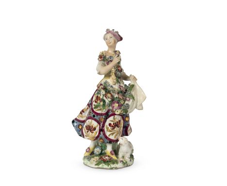 An interesting Derby figure of a shepherdessLate 18th centuryProbably decorated in London, modelled standing on a low base ap