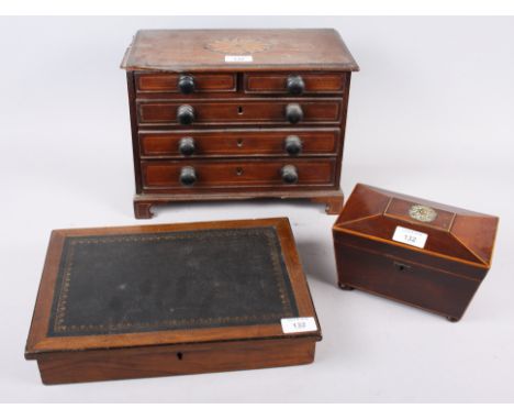 A late 19th century / early 20th century sarcophagus tea caddy, 7 1/2" wide, a miniature mahogany chest of two short and thre