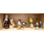 A Beswick barn owl, 7 1/2" high, a Beswick kingfisher, 4 1/2" high, a resin African fish eagle and a