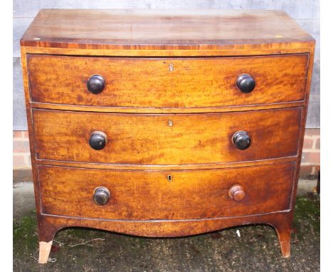 A 19th century mahogany and banded chest of three graduated drawers with knob handles, on splayed bracket supports, 39" wide