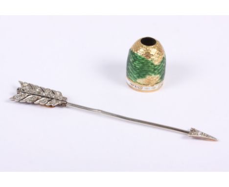 A white metal and diamond set arrow stick pin and an enamelled part clasp