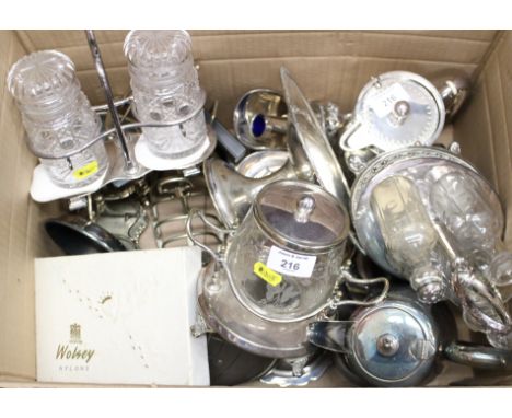 A silver plated Mappin &amp; Webb lidded jug, a plated biscuit barrel, assorted plated cruets and toast racks and other items