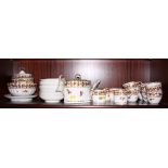 An early 19th century Derby pattern 559 part tea and coffee service, including a teapot, a sugar