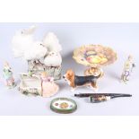 A Beswick bassett hound, 4 3/4" high, a Coalport tazza, decorated fruit, and a Capodimonte model