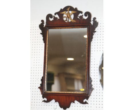 A mahogany framed wall mirror of early 18th century design with hoho bird crest, plate 17 1/2" x 11 1/2”, and a mahogany fram