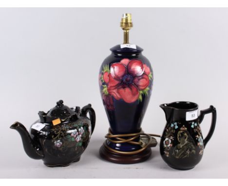 A Moorcroft "Anemone" pattern table lamp, 14 1/2" high overall, a Queen Victoria commemorative jug and a similar teapot