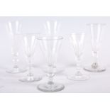 A pair of 19th century faceted champagne flutes, 6" high, one similar smaller and three ports