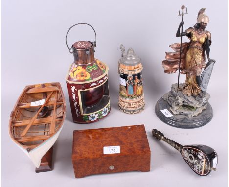 A figure of Britannia, on stand, 13" high, a model rowing boat, a musical box, a stein, a mandolin and other items